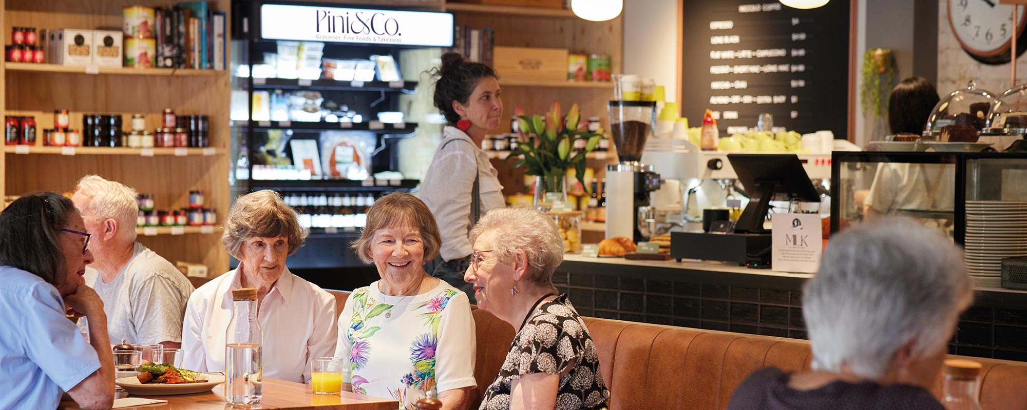 Europa on Alma café, Pini & Co - interior with people enjoying coffee and snacks